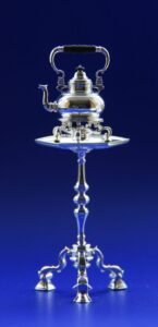 Miniature silver teapot and stand